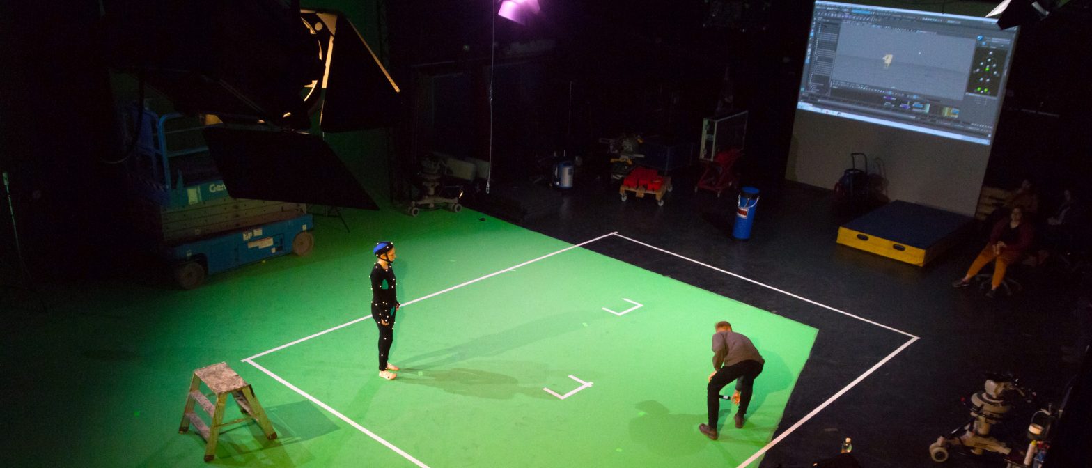 View of motion capture floor with actor and crew