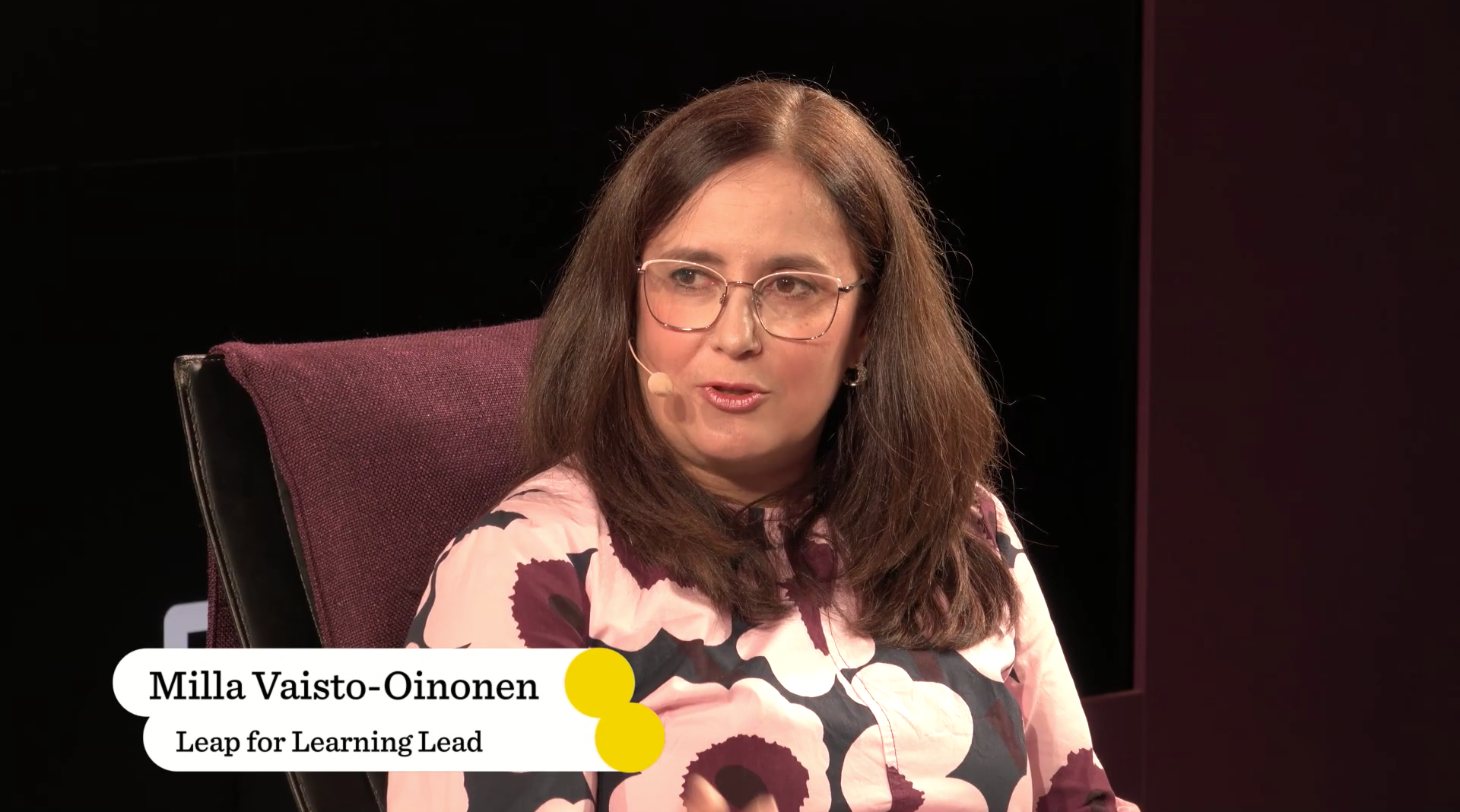 woman speaking in panel discussion